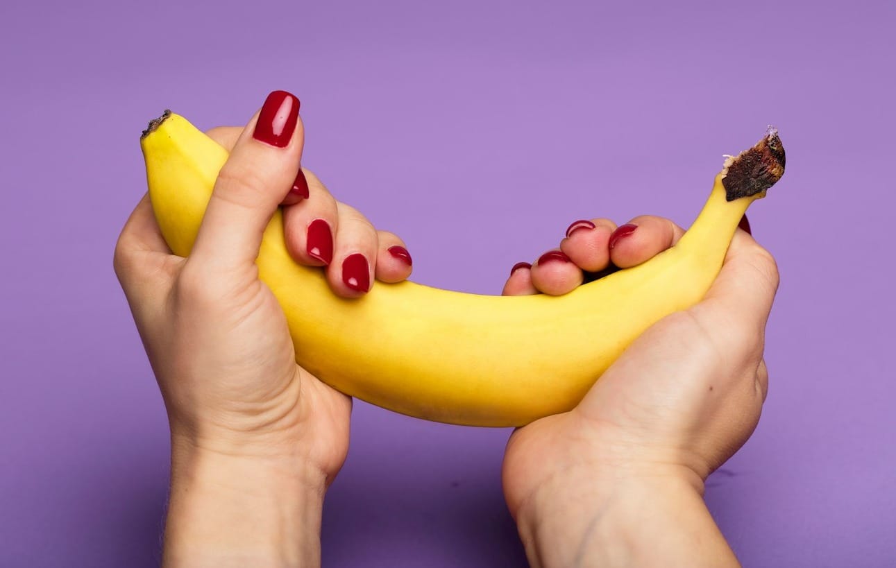 person holding yellow banana fruit